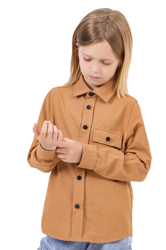 Stylish Kid Fixing His Button Of Brown Shirt