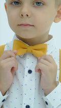 A kids showing off yellow chic outfit