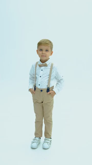 A kids showing off beige chic outfit